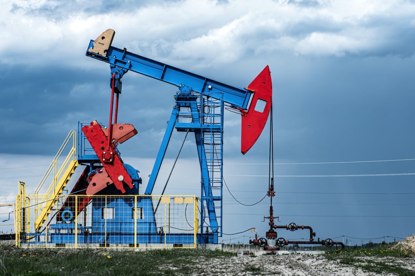 Extraction of crude oil in oilfield. Oil drilling rig pumps oil.