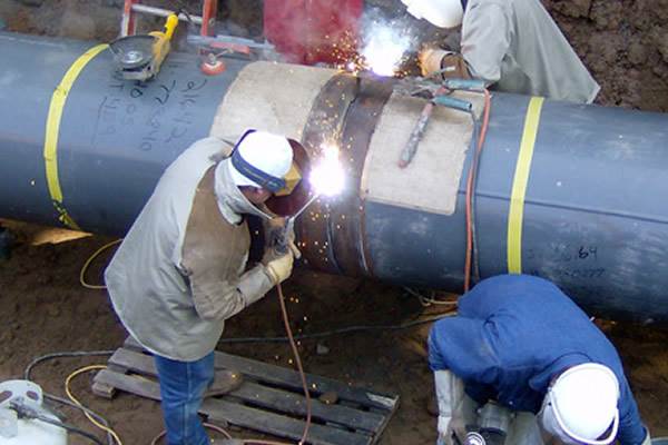 industrial factory worker working in metal manufacturing industry